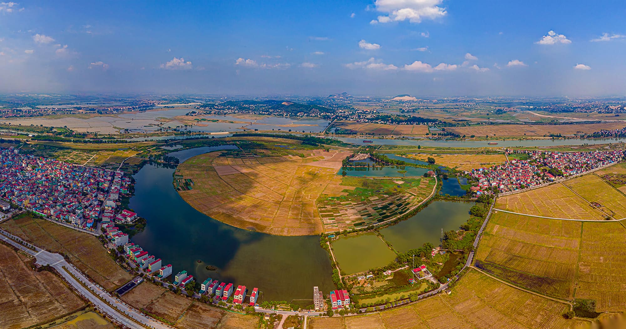Hiện trạng khu đất dự án Vinhomes Hòa Long Bắc Ninh bên khúc sông uốn lượn